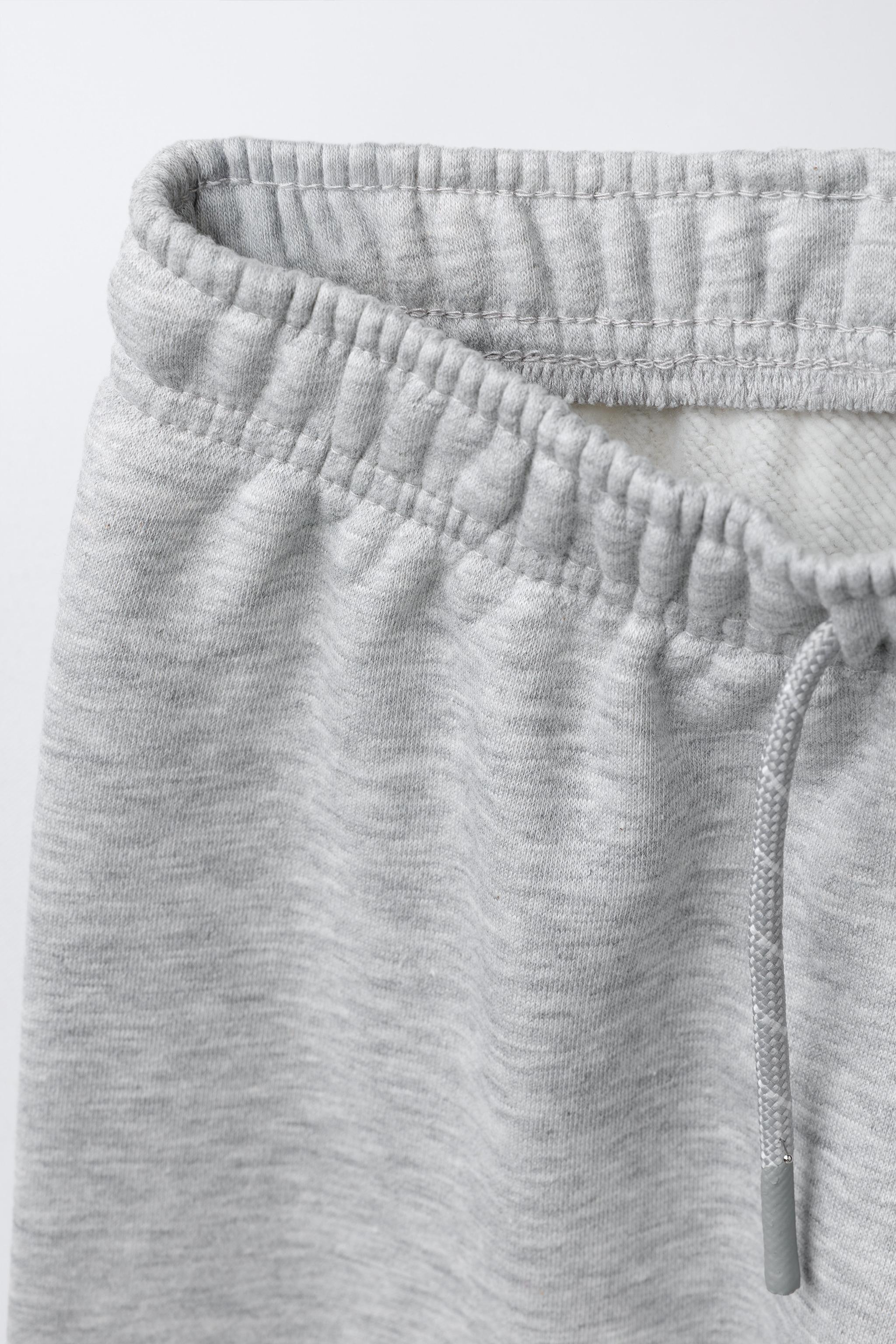 PANTALON EN MOLLETON À JAMBES LARGES